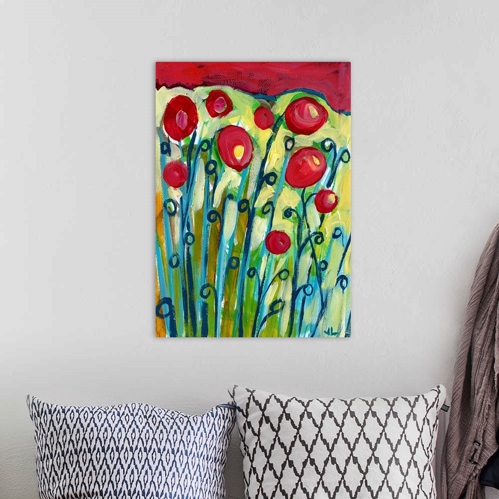 A bohemian room featuring This large vertical painting shows long flowers sprouting from the ground with red tops.