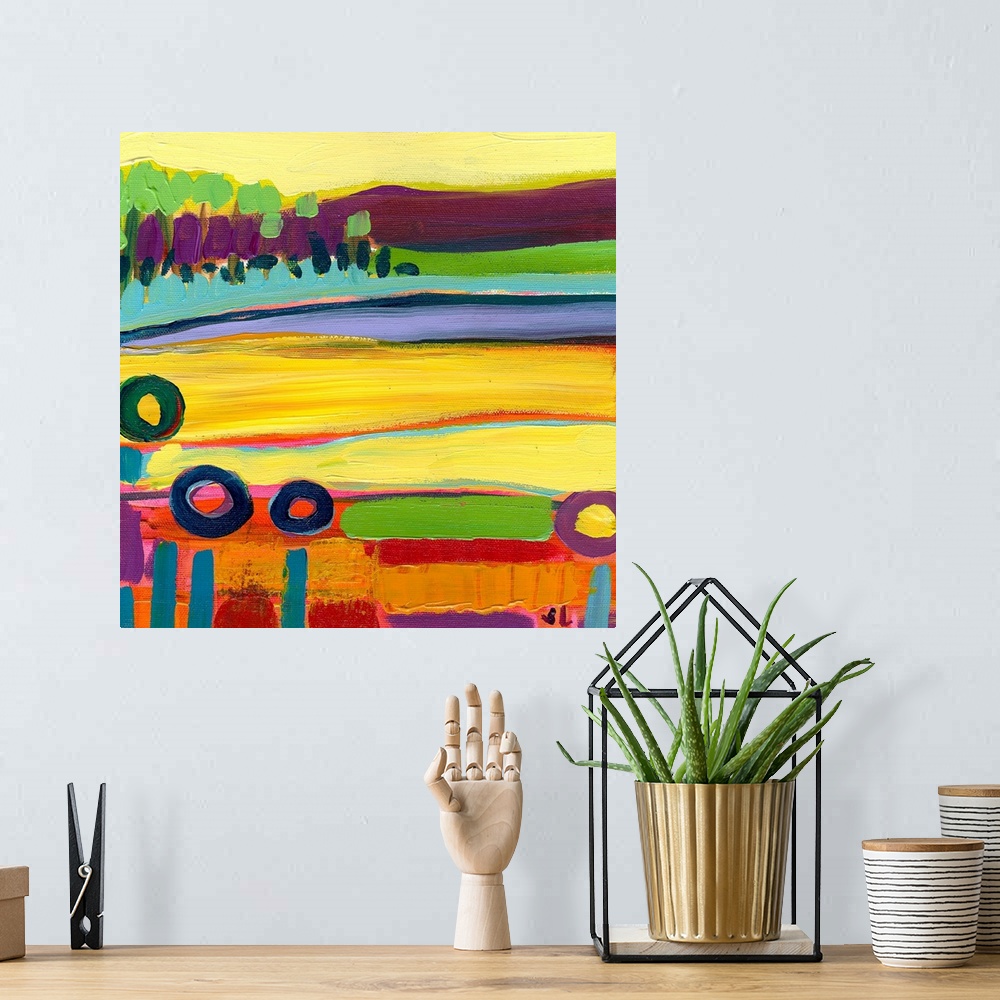 A bohemian room featuring Large square contemporary art of a colorful landscape that includes fields in the foreground and ...