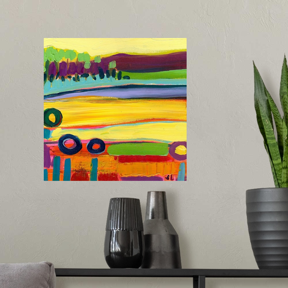 A modern room featuring Large square contemporary art of a colorful landscape that includes fields in the foreground and ...