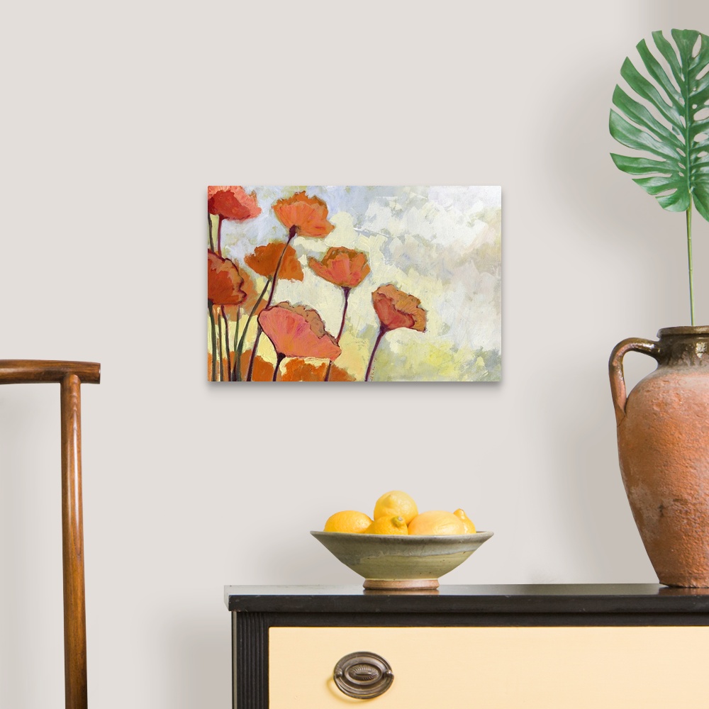 A traditional room featuring Orange and peach colored flowers are painted against a soft yellowish background.