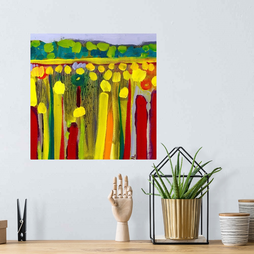 A bohemian room featuring Large contemporary art depicts an open field of flowers in the foreground contrasted by rolling h...