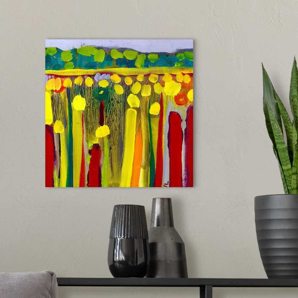 A modern room featuring Large contemporary art depicts an open field of flowers in the foreground contrasted by rolling h...