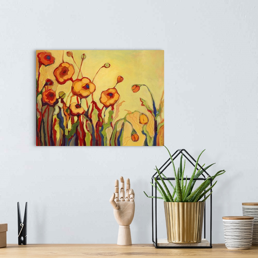 A bohemian room featuring Abstract painting of flowers, some open and some closed, against a bright background.