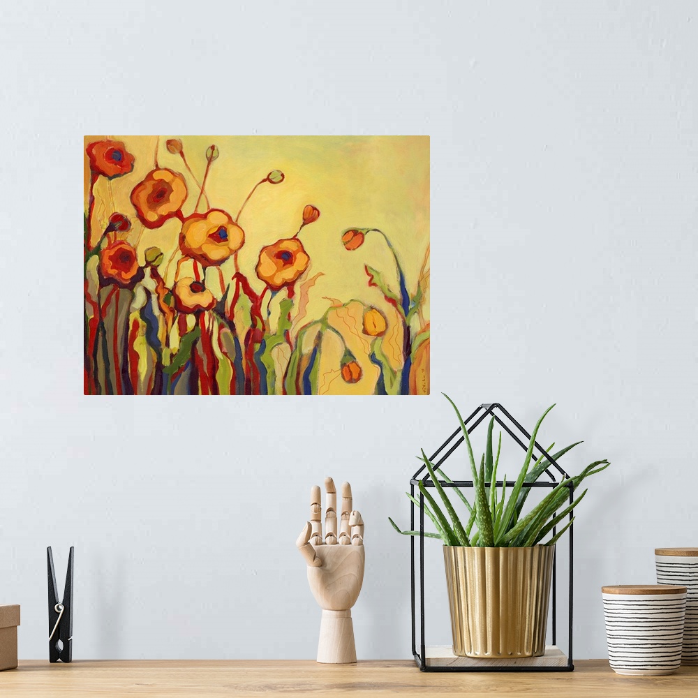A bohemian room featuring Abstract painting of flowers, some open and some closed, against a bright background.