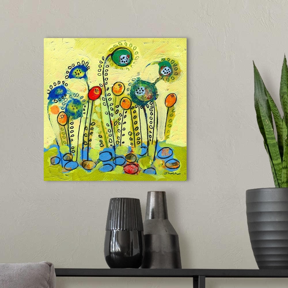 A modern room featuring Contemporary abstract painting of seeds blossoming into flowers.  Simple shapes are used to creat...