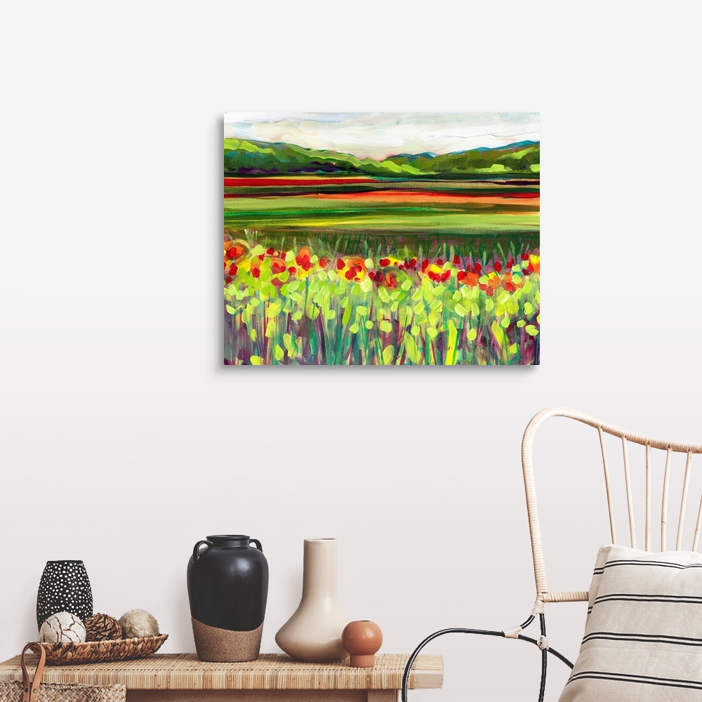 A farmhouse room featuring Large, landscape fine art painting of a meadow of wildflowers in front of a green hillside on the...