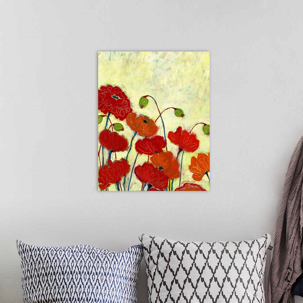 A bohemian room featuring A vertical painting of colorful flowers blooming with a yellow textured background.