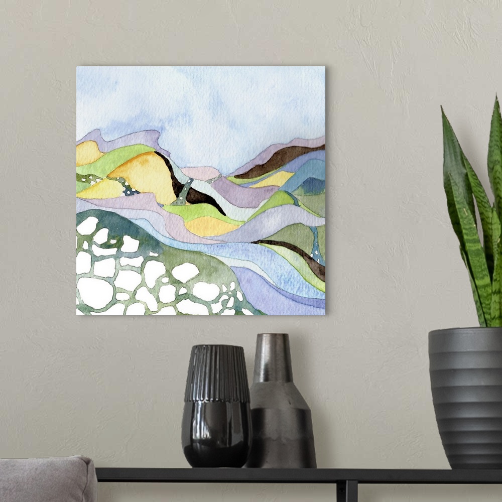A modern room featuring Contemporary watercolor painting of a landscape with a river running through pastel-colored hills.