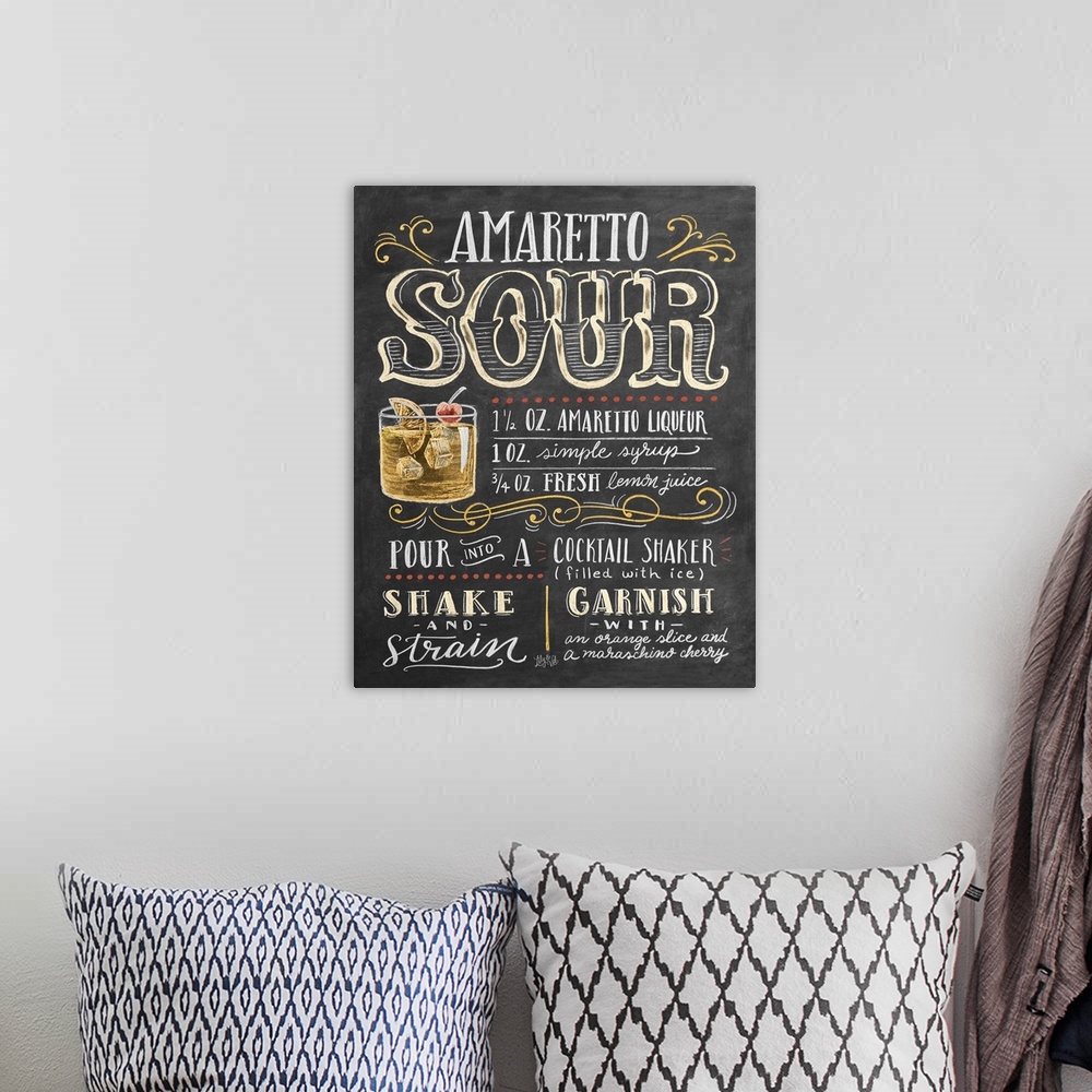 A bohemian room featuring Handlettered recipe for an Amaretto Sour cocktail with the appearance of a chalkboard drawing.