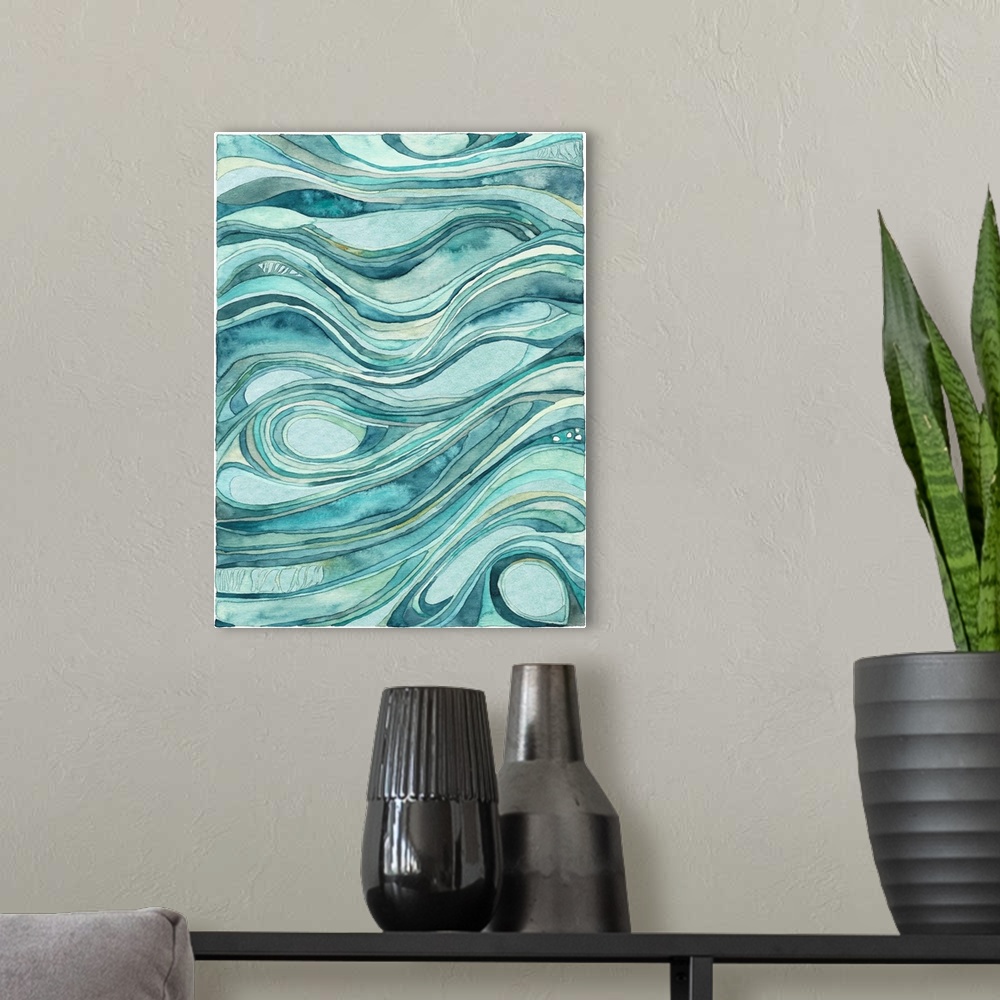 A modern room featuring Contemporary abstract watercolor artwork in blue shades, resembling waves of flowing water.