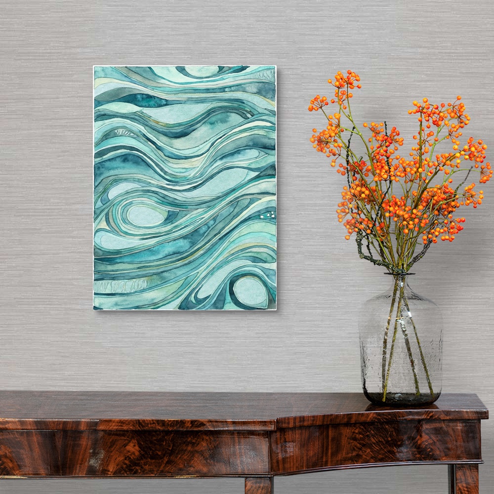 A traditional room featuring Contemporary abstract watercolor artwork in blue shades, resembling waves of flowing water.