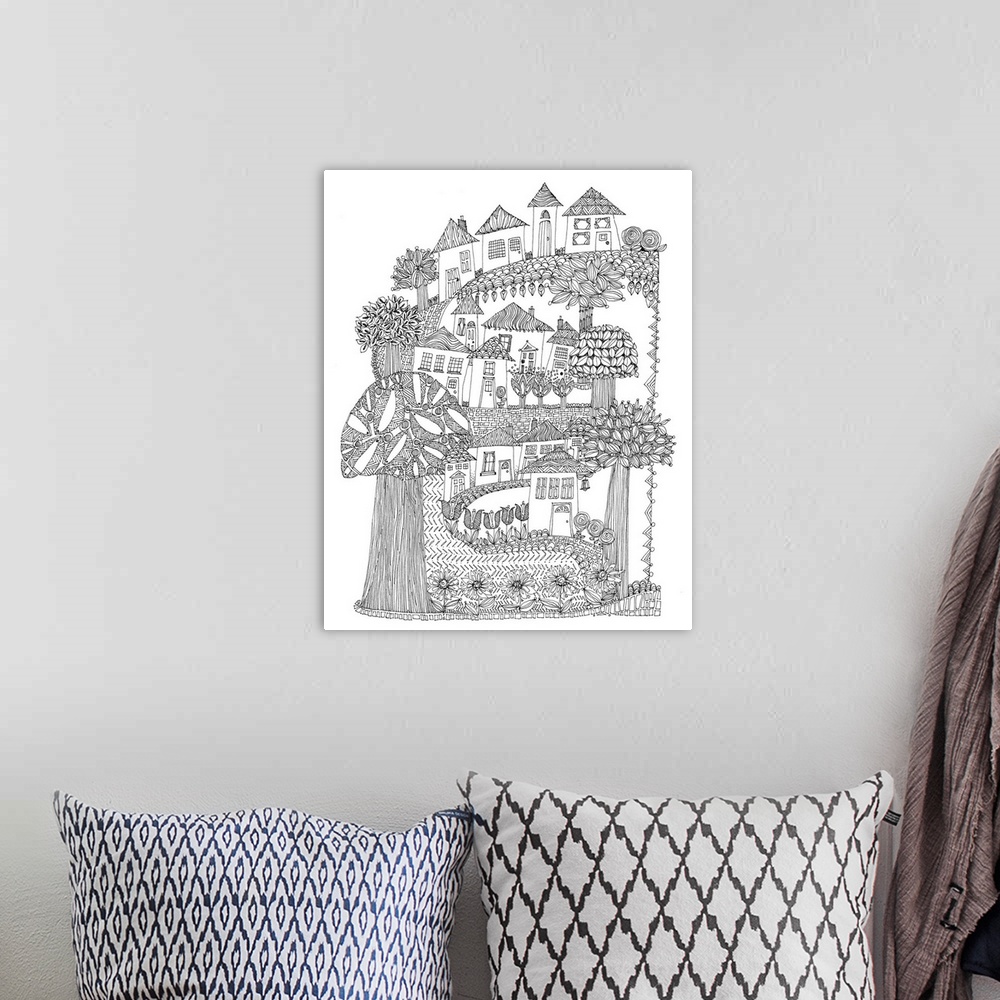 A bohemian room featuring Black and white line art of a winding road with houses and trees.