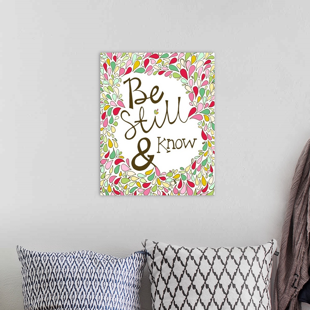 A bohemian room featuring A phrase from Psalm 46:10 from the Bible, hand written and surrounded by colorful shapes.