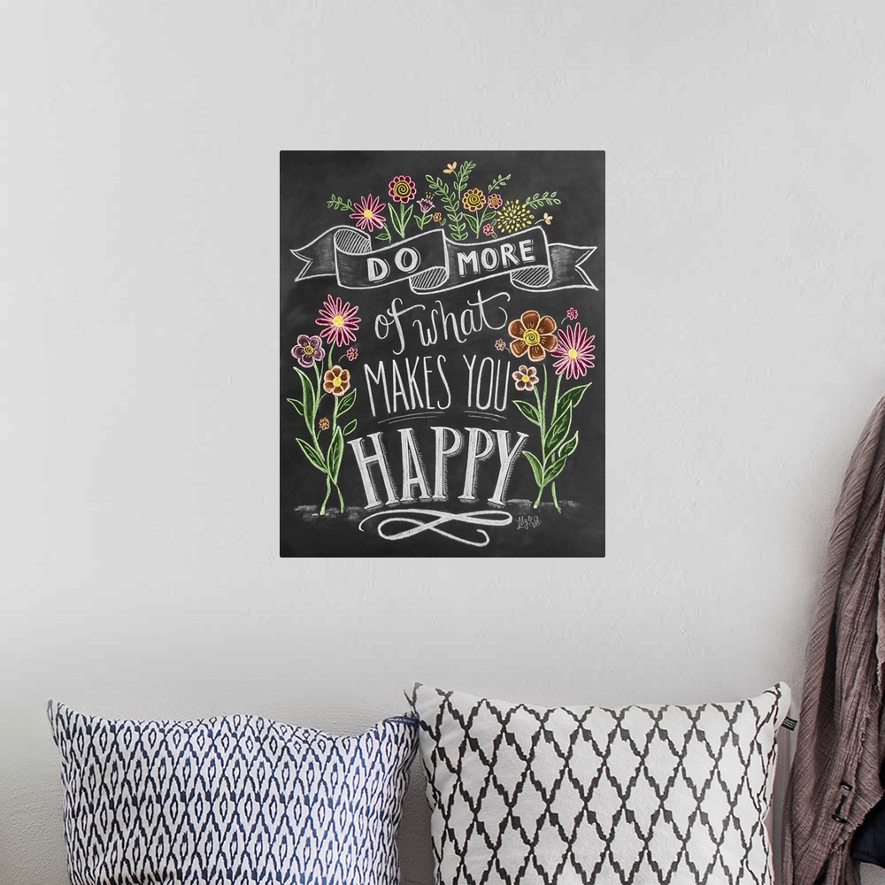A bohemian room featuring "Do more of what makes you happy" handwritten and illustrated with flowers.