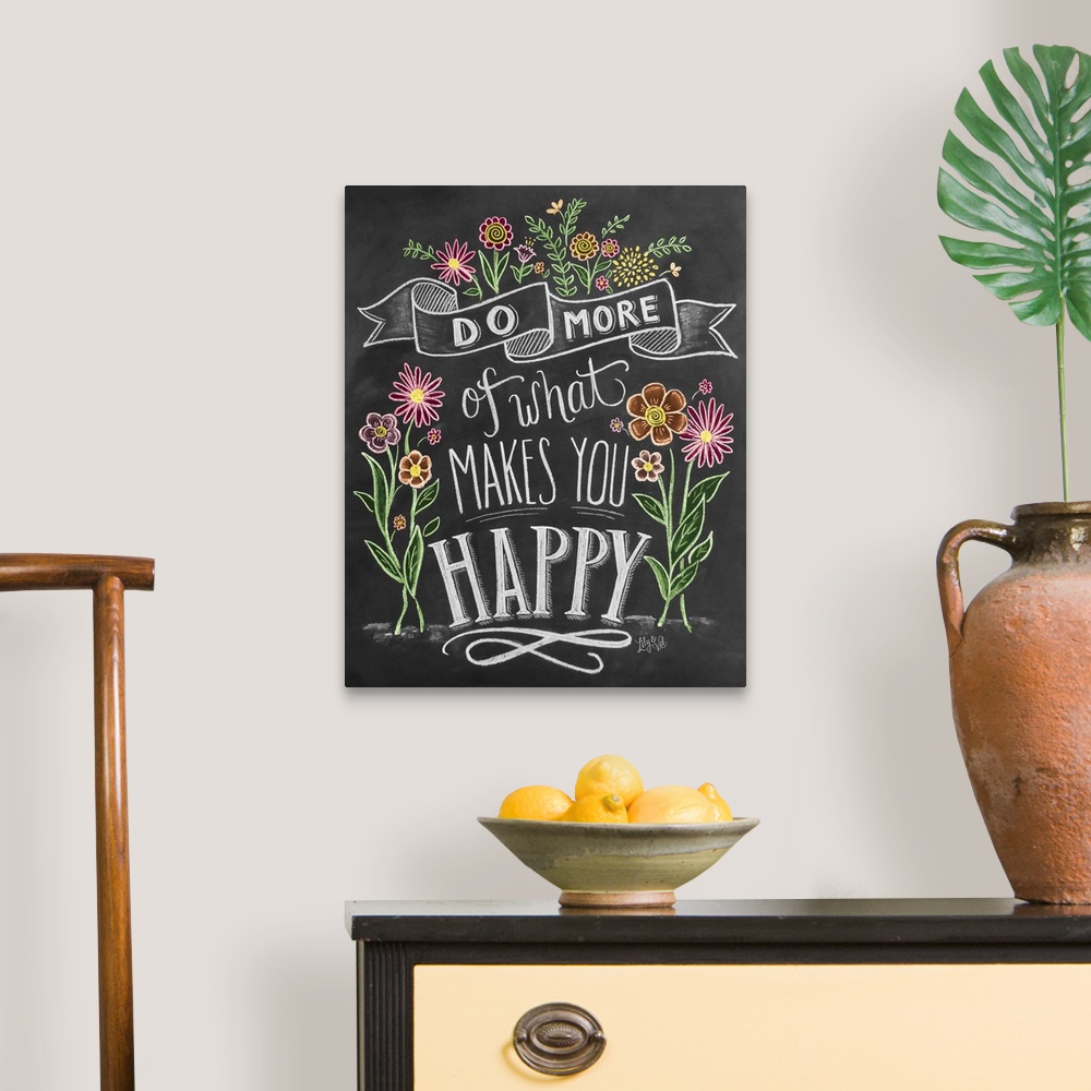 A traditional room featuring "Do more of what makes you happy" handwritten and illustrated with flowers.