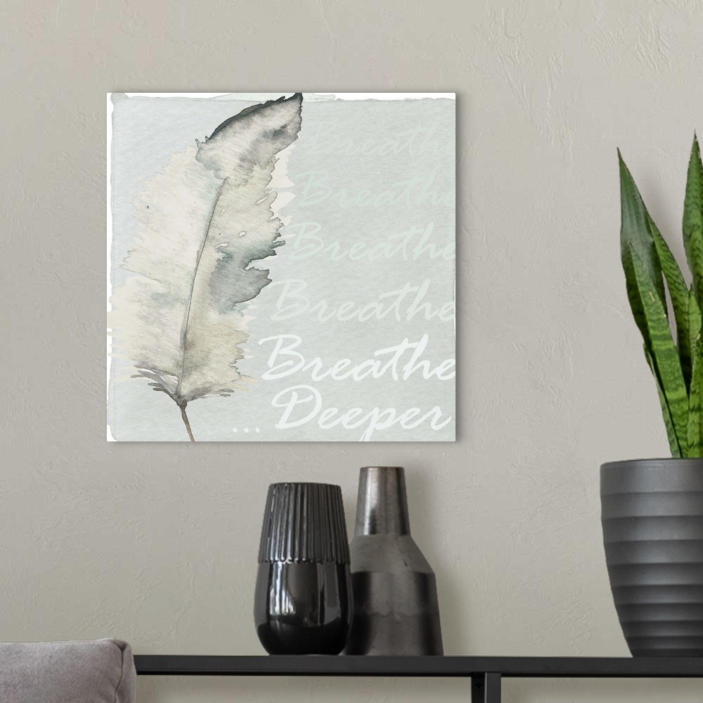 A modern room featuring Decorative watercolor painting of a feather in grey tones with the words "Breathe Deeper."