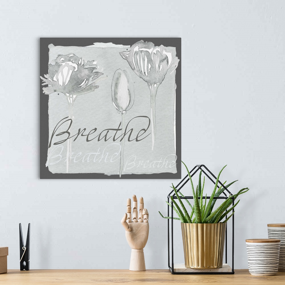 A bohemian room featuring Decorative watercolor painting of a three grey flowers with the word "Breathe" repeated in the ba...