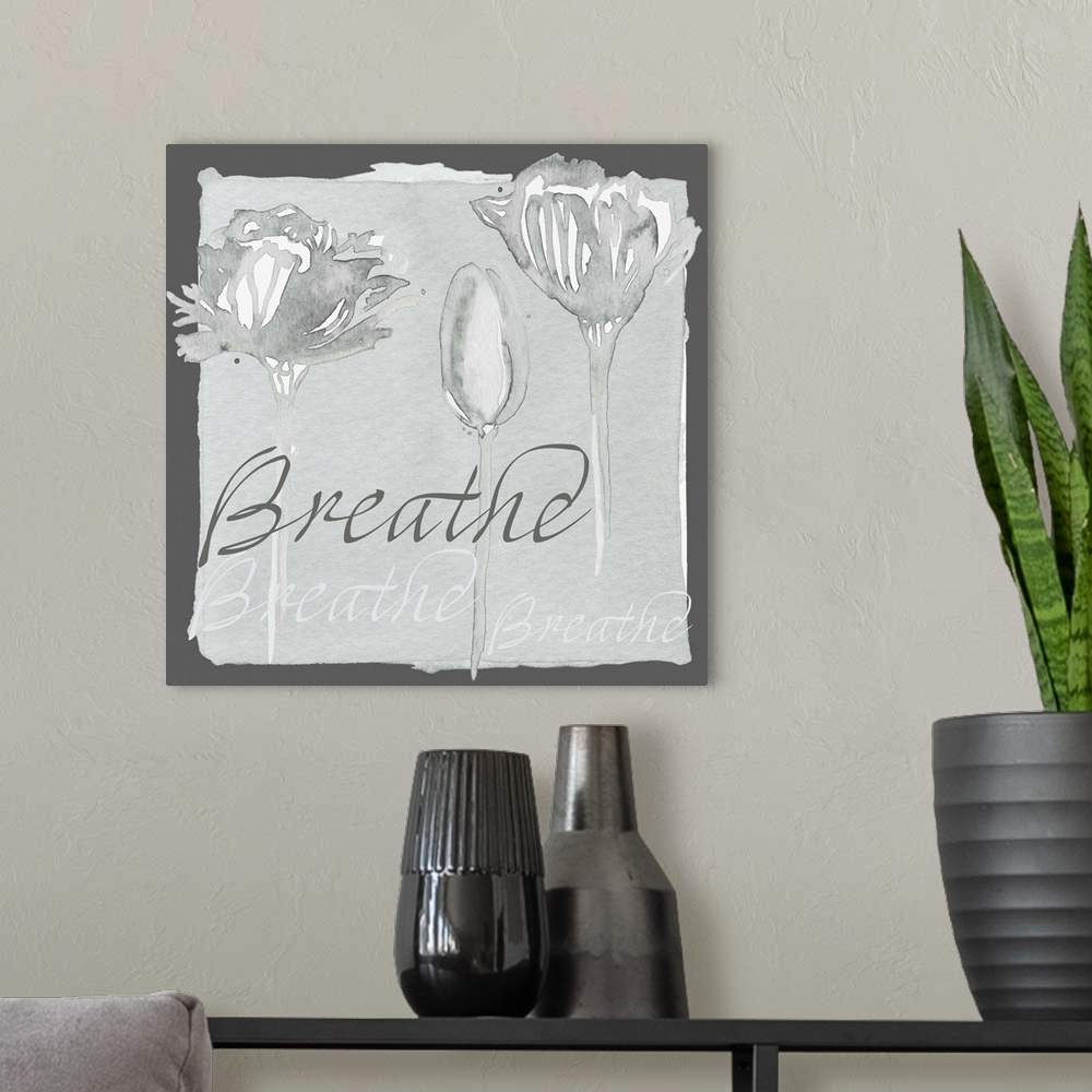 A modern room featuring Decorative watercolor painting of a three grey flowers with the word "Breathe" repeated in the ba...