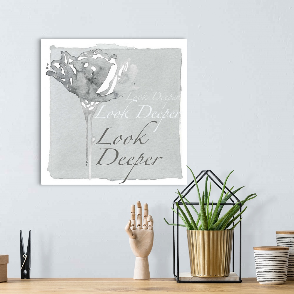 A bohemian room featuring Decorative watercolor painting of a grey flower with the words "Look deeper" repeated in the back...