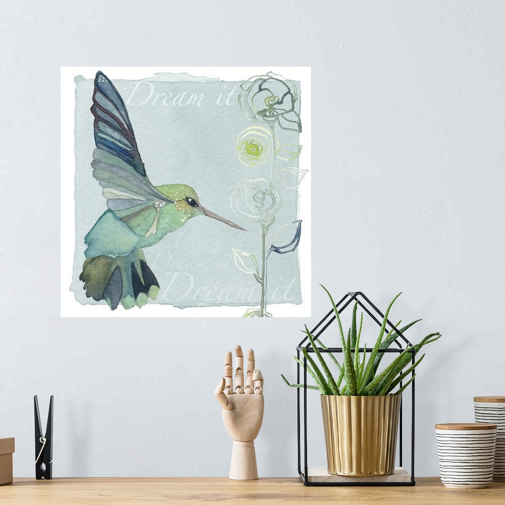 A bohemian room featuring Decorative watercolor painting of a teal-colored hummingbird and a flower with the words "Dream it."