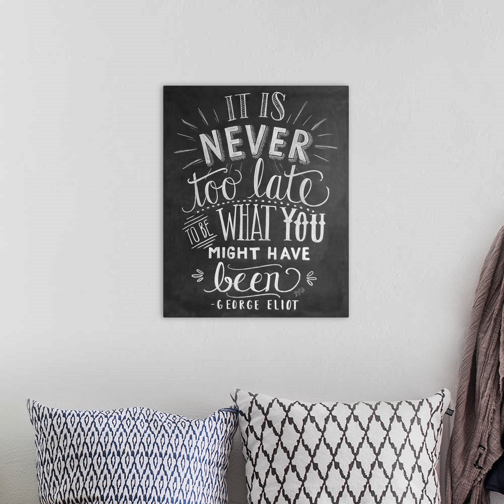 A bohemian room featuring The phrase "It is never too late to be what you might have been" by George Eliot, handwritten in ...
