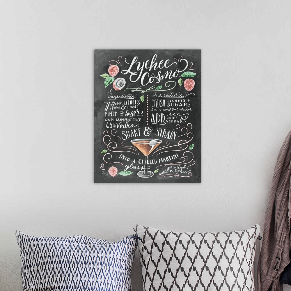 A bohemian room featuring Handlettered recipe for a Lychee Cosmo cocktail with the appearance of a chalkboard drawing.