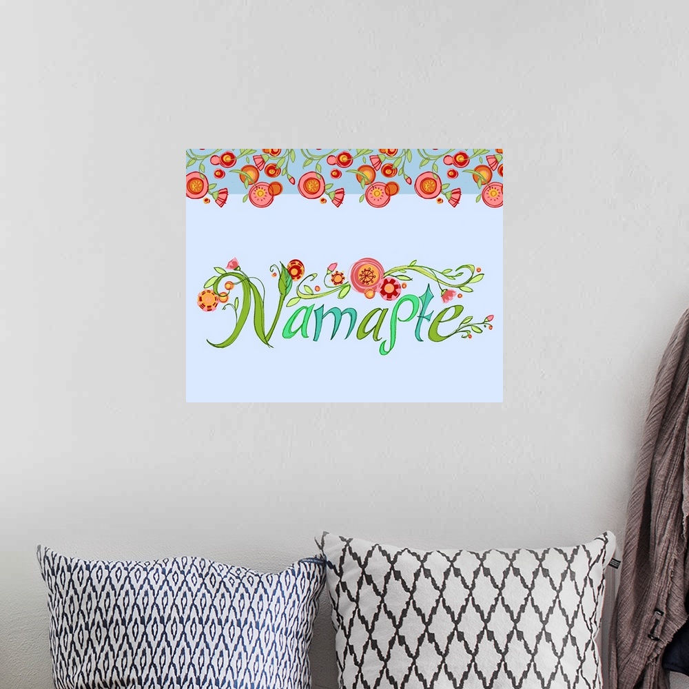 A bohemian room featuring "Namaste," handwritten and decorated with round red flowers.