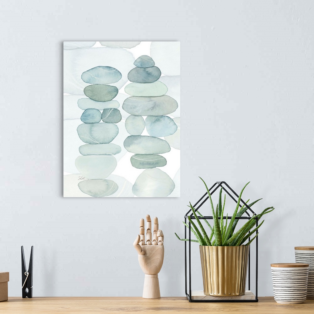 A bohemian room featuring Modern coastal hand painted watercolor of stacked beach rocks and pebbles