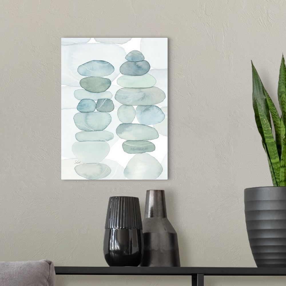 A modern room featuring Modern coastal hand painted watercolor of stacked beach rocks and pebbles