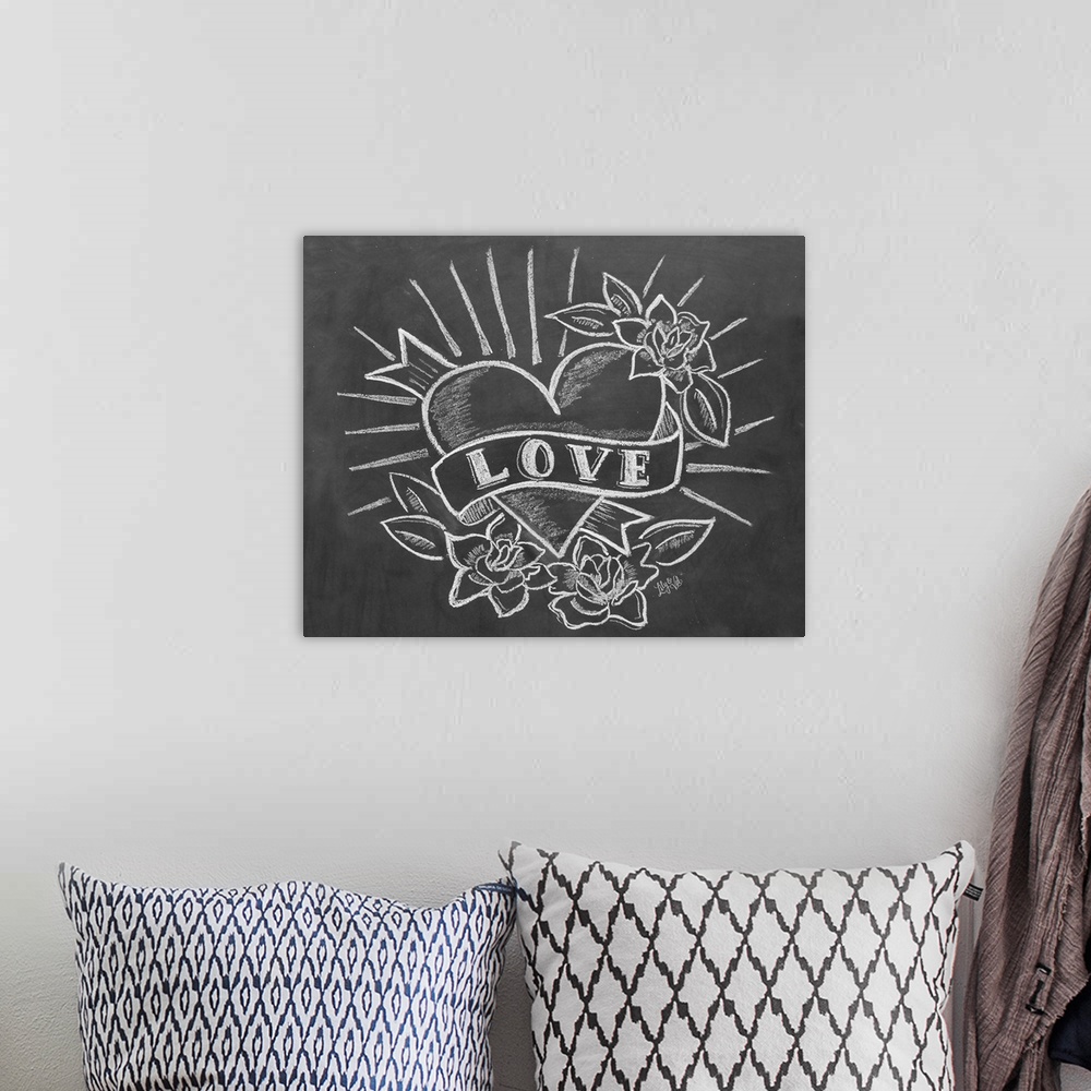 A bohemian room featuring "Love" with a tattoo-style heart drawing in white chalk on a black background.
