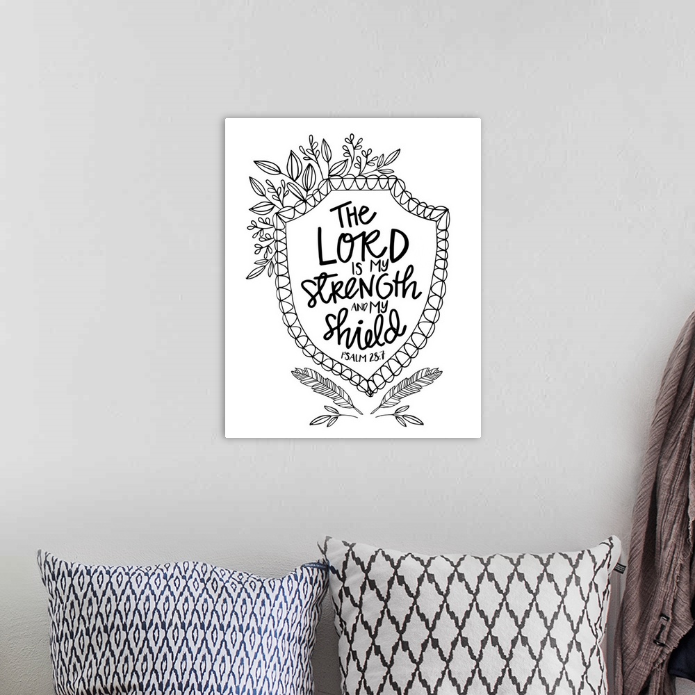 A bohemian room featuring Bible passage that reads "The Lord is my strength and my shield," Psalm 28:7.