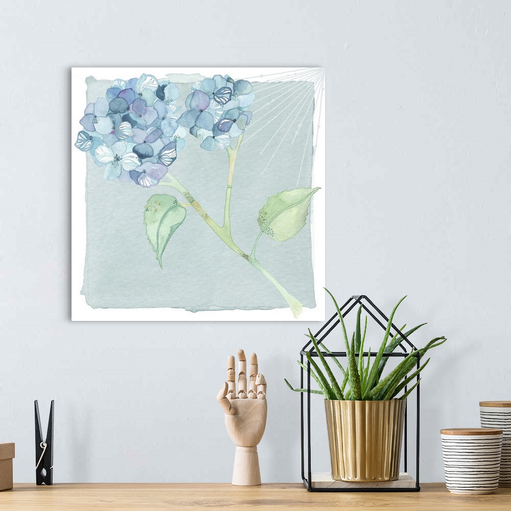 A bohemian room featuring Watercolor artwork of blue hydrangea flowers on a stem with two green leaves.