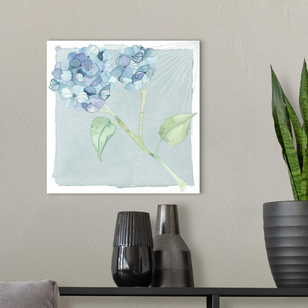 A modern room featuring Watercolor artwork of blue hydrangea flowers on a stem with two green leaves.