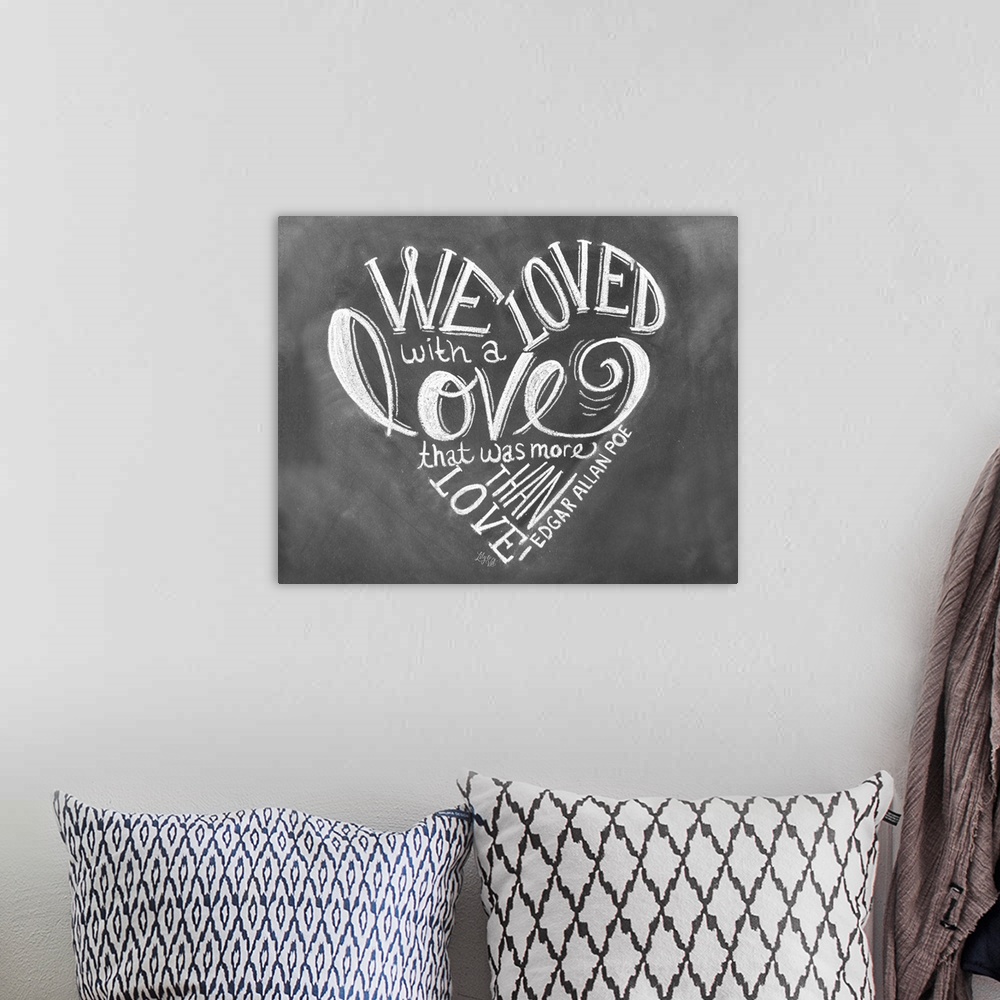 A bohemian room featuring "We loved with a love that was more than love" by Edgar Allan Poe, handwritten in white chalk on ...