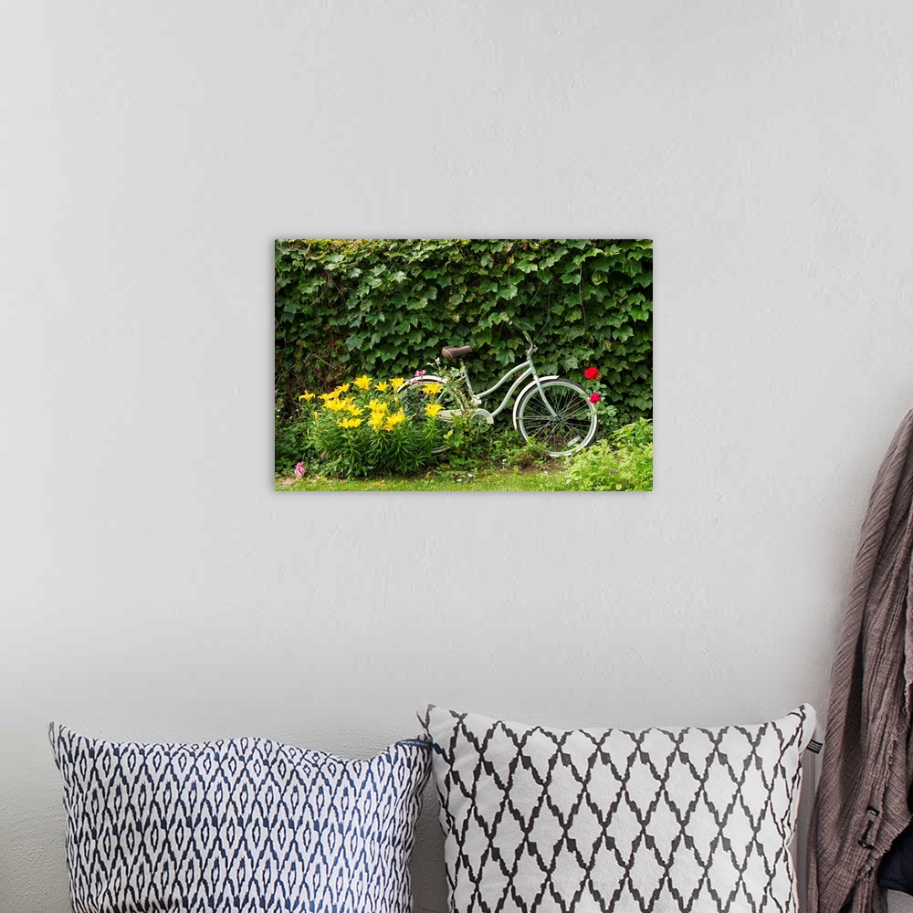 A bohemian room featuring A bicycle in a beautiful garden.