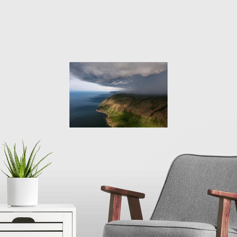 A modern room featuring A thunderstorm moves over the eastern shore of Lake Albert.