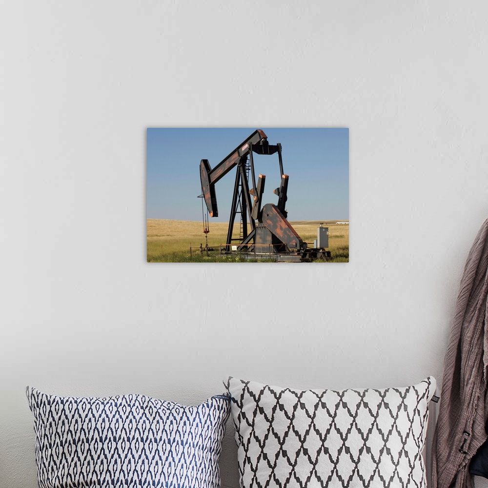 A bohemian room featuring An oil rig pumps oil from the Montana ground.