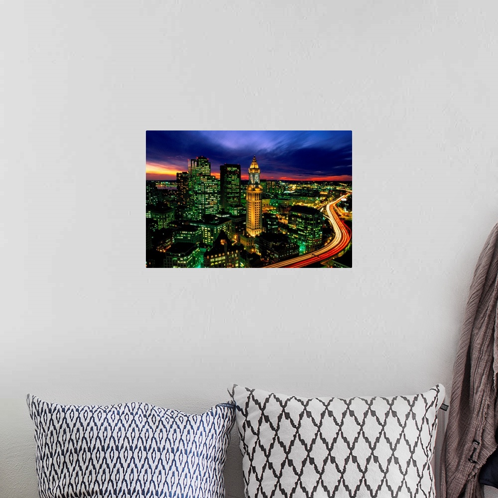 A bohemian room featuring Time lapsed evening photograph of the Custom House Tower and the highway that passes in front of it.