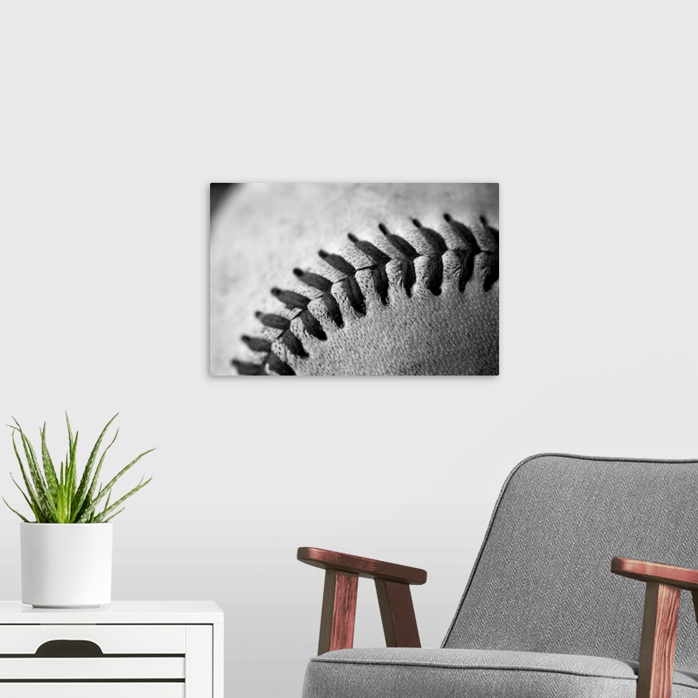 A modern room featuring Detail shot of a baseball.