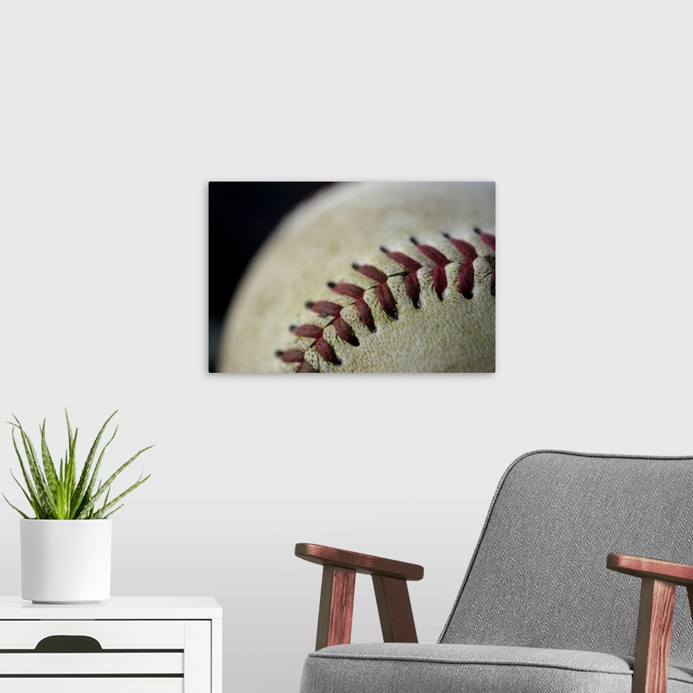 A modern room featuring Detail shot of a baseball.
