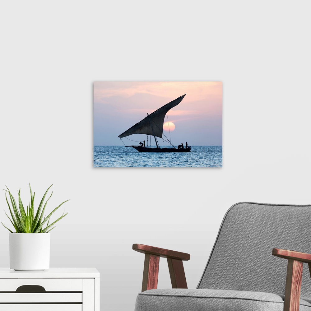 A modern room featuring A Dhow Sails In Front Of The Setting Sun, Stone Tpwn, Zanzibar, Tanzania
