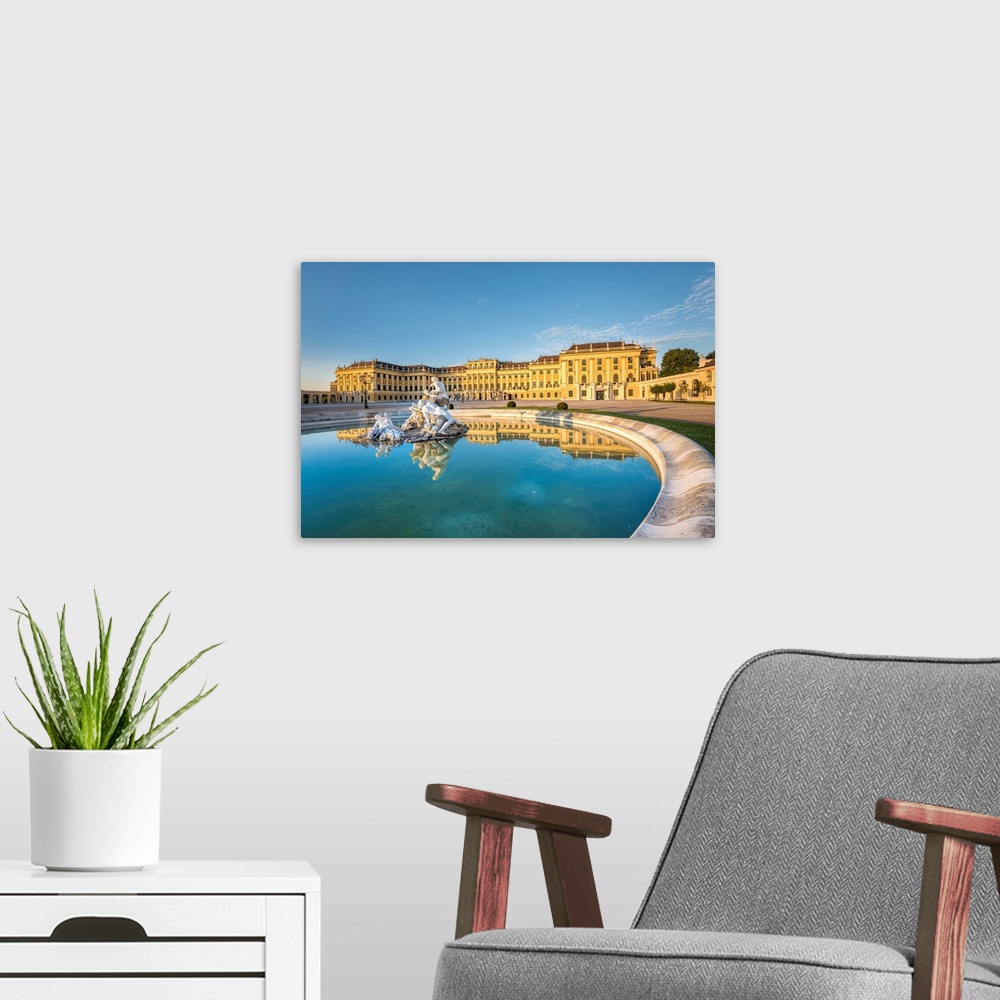 A modern room featuring Vienna, Austria, Europe. The Schonbrunn Palace At Sunrise. A Fountain In The Forecourt With The S...