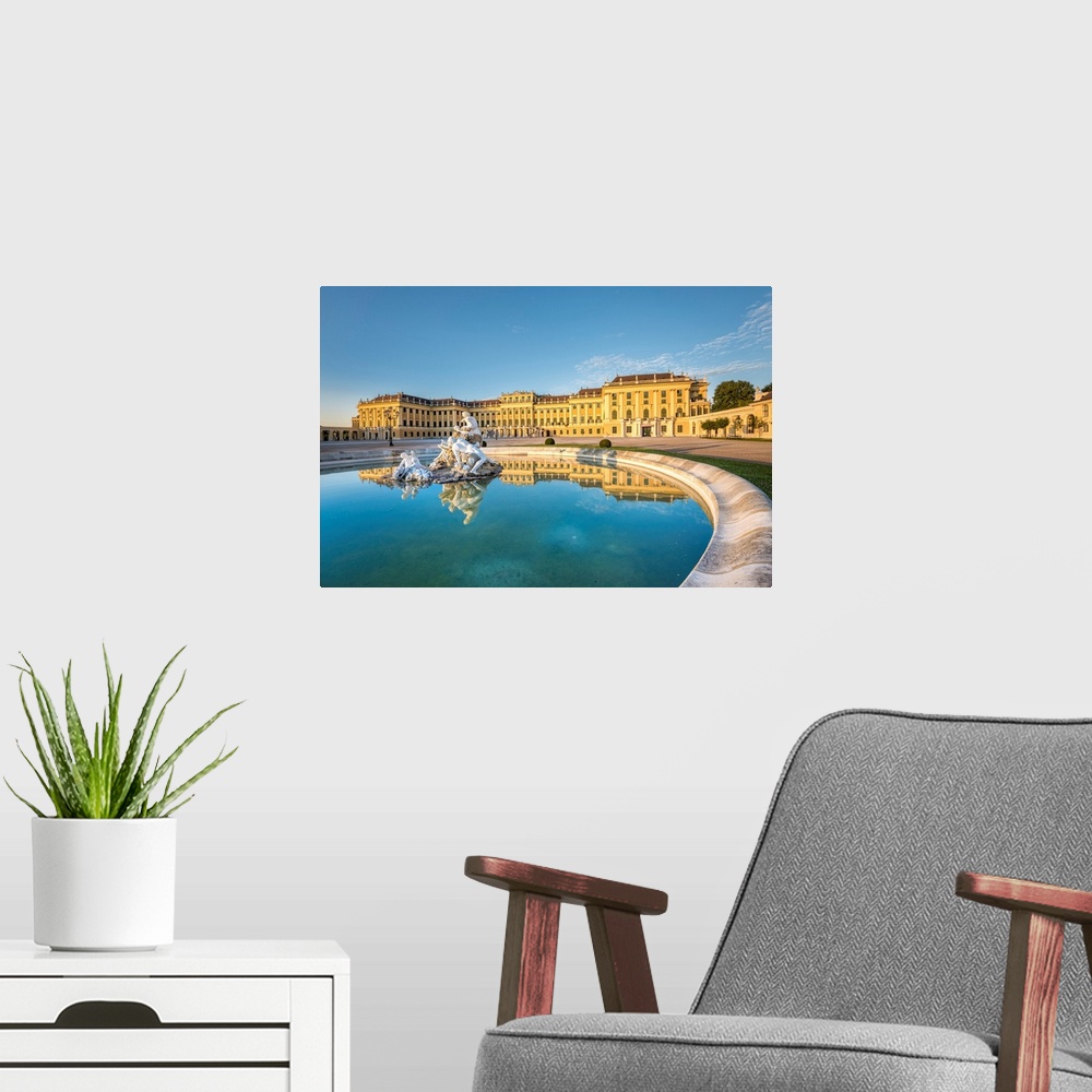 A modern room featuring Vienna, Austria, Europe. The Schonbrunn Palace At Sunrise. A Fountain In The Forecourt With The S...