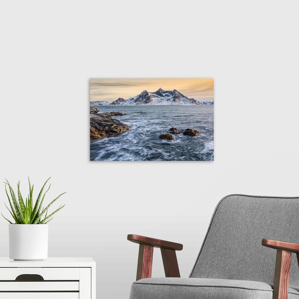 A modern room featuring A magical winter sunset around Flakstad beach, Lofoten Islands, Northern Norway