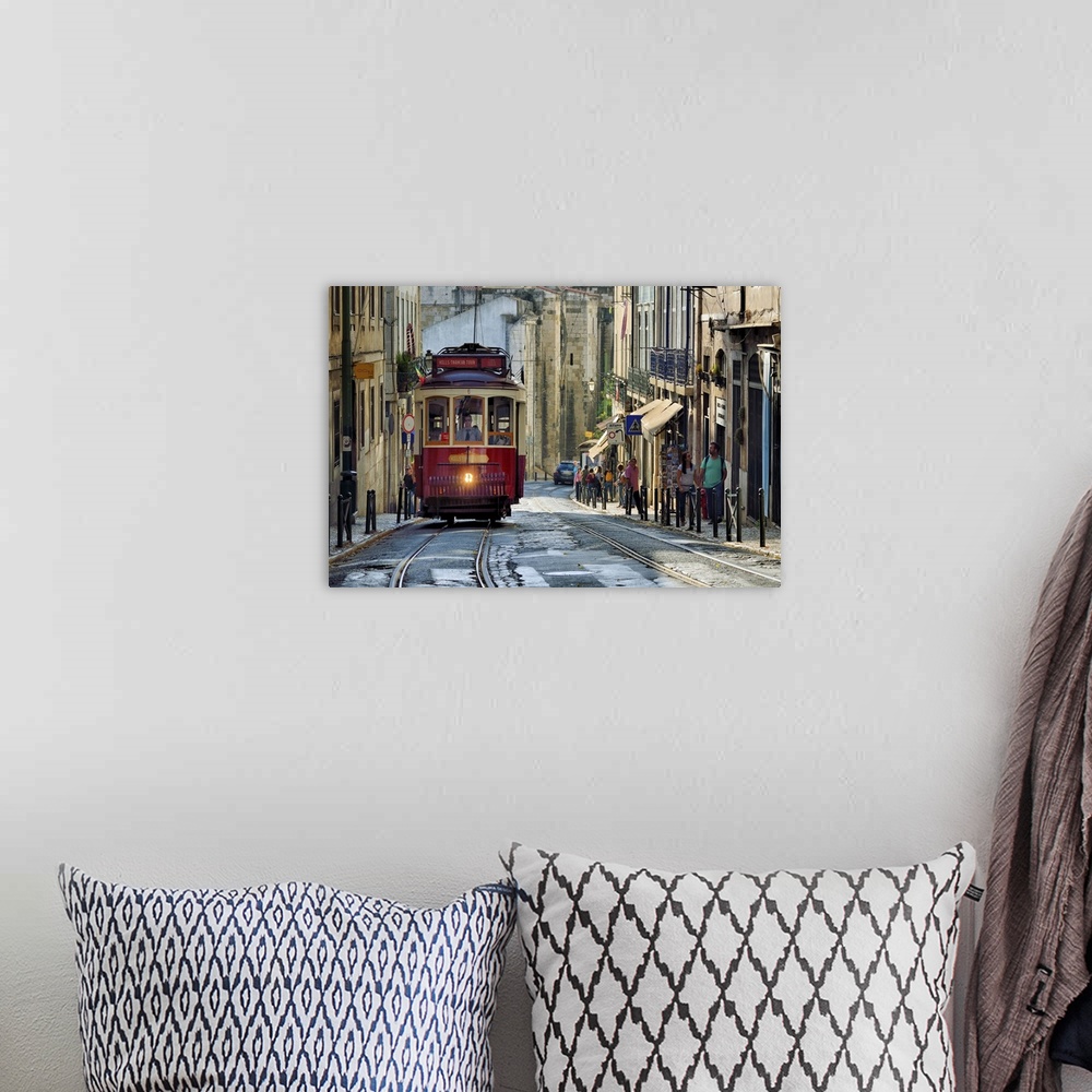 A bohemian room featuring A tramway in Alfama district with the Motherchurch (Se Catedral) in the background. Lisbon, Portu...