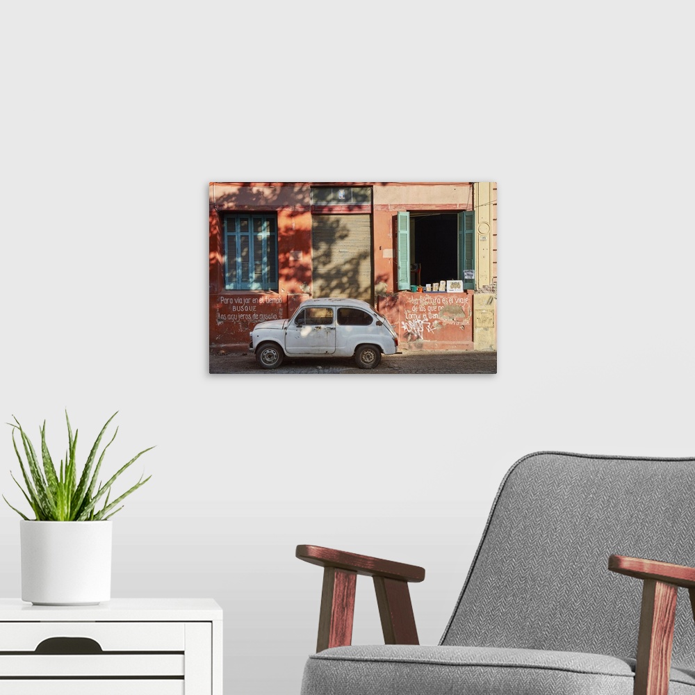 A modern room featuring A vintage car in a street of La Boca, Buenos Aires, Argentina.