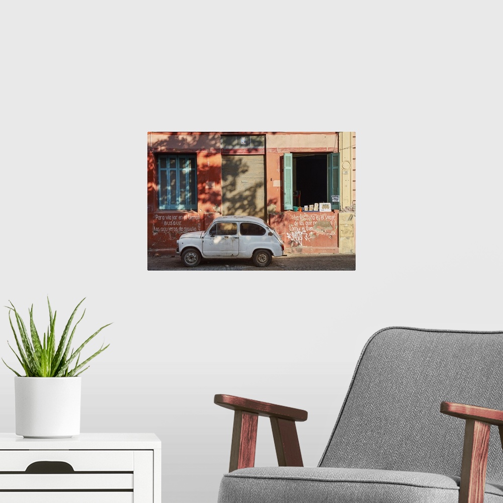 A modern room featuring A vintage car in a street of La Boca, Buenos Aires, Argentina.