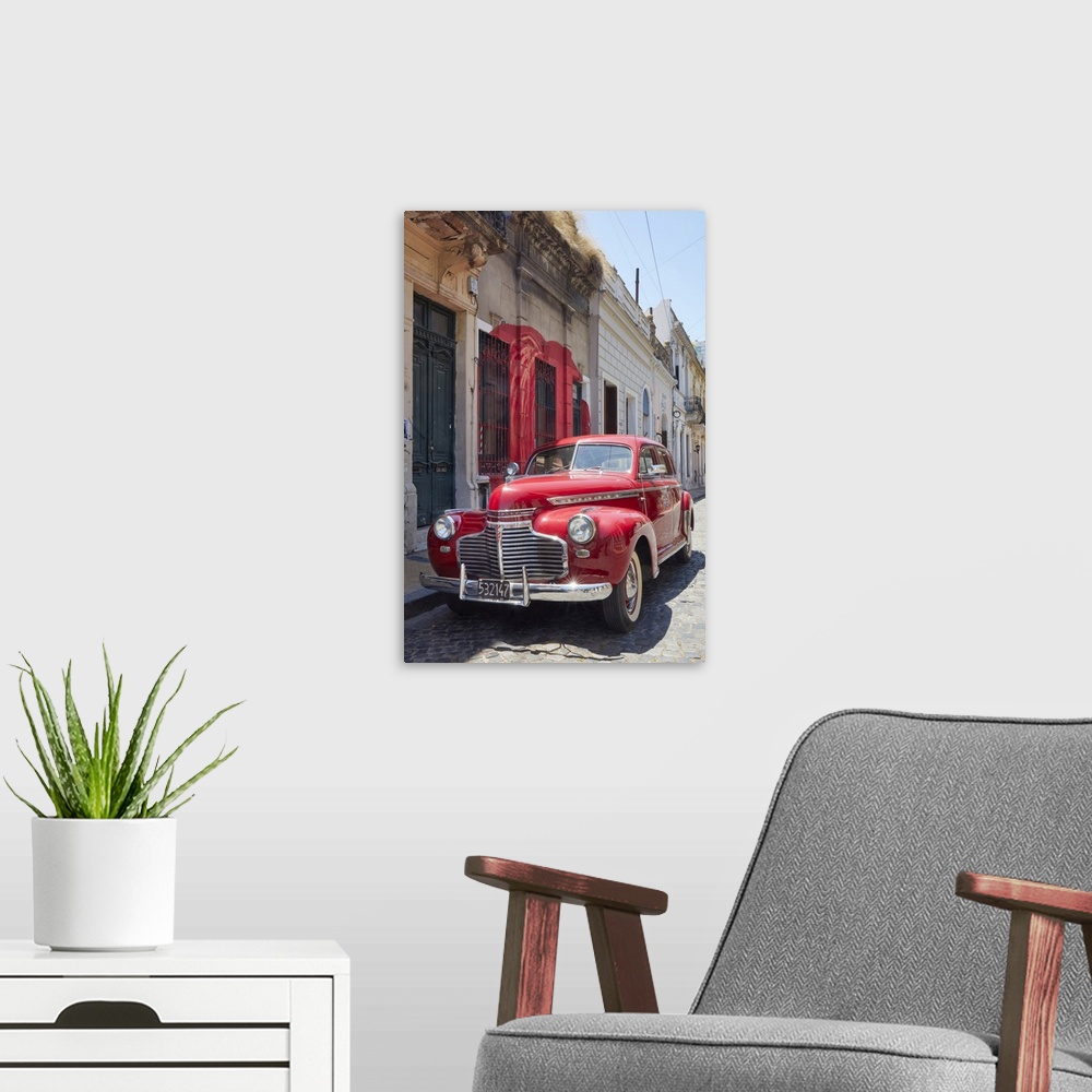 A modern room featuring A vintage Chevrolet Master Deluxe car in front of a colonial house in San Telmo, Buenos Aires, Ar...