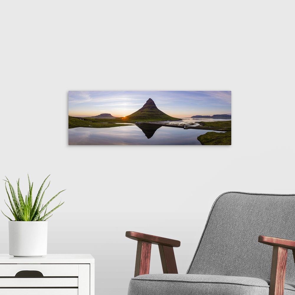 A modern room featuring Aerial drone view of mount Kirkjufell at sunset, Snaefellsnes peninsula, Iceland