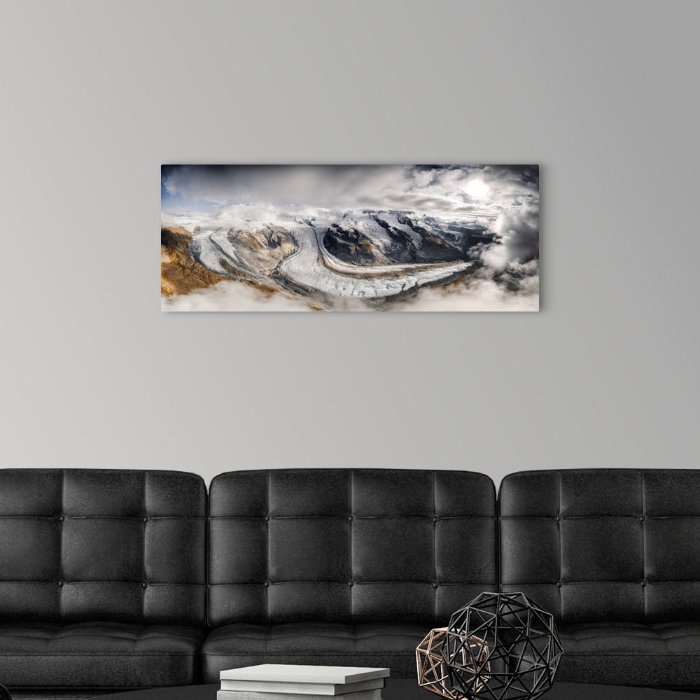 A modern room featuring Aerial panoramic of Gorner Glacier (Gornergletscher) covered by clouds, Zermatt, canton of Valais...